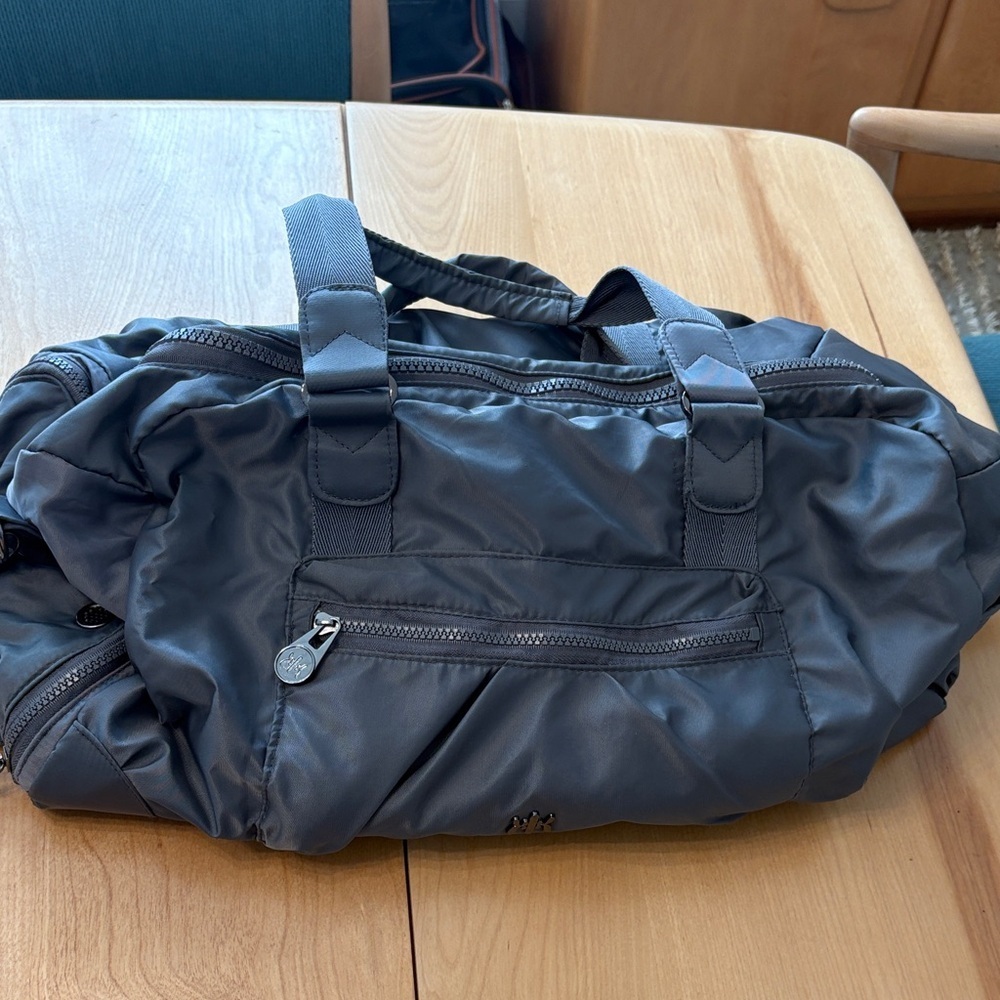 Kyodan gray gym/weekender bag.  Top handle + adjustable shoulder strap.